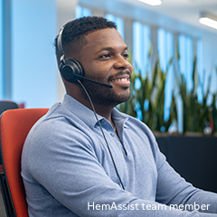 Portrayal of a man sitting at desk wearing a headset