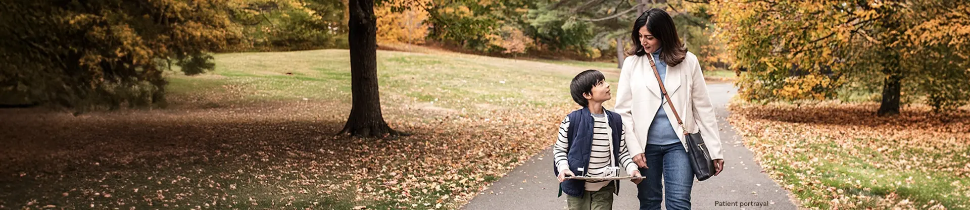 Patient portrayal of a child and adult walking on a path