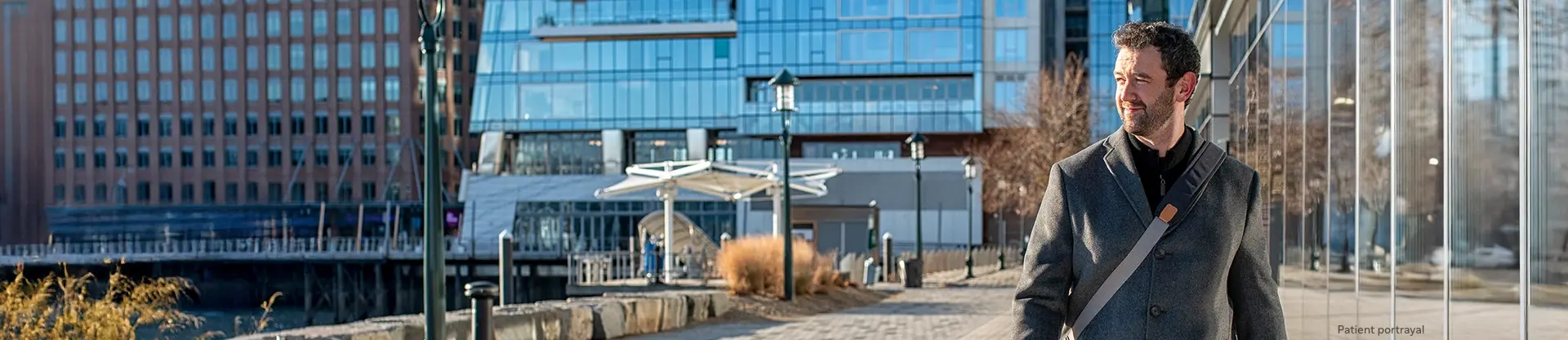 Patient portrayal of a man walking in the city